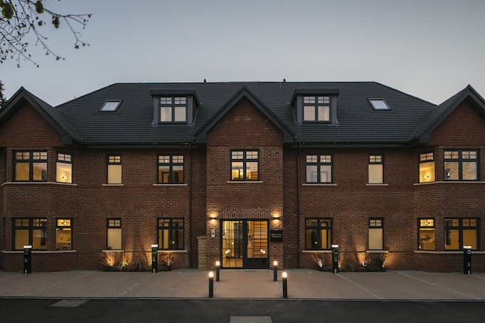 The completed Weston Court building at dusk